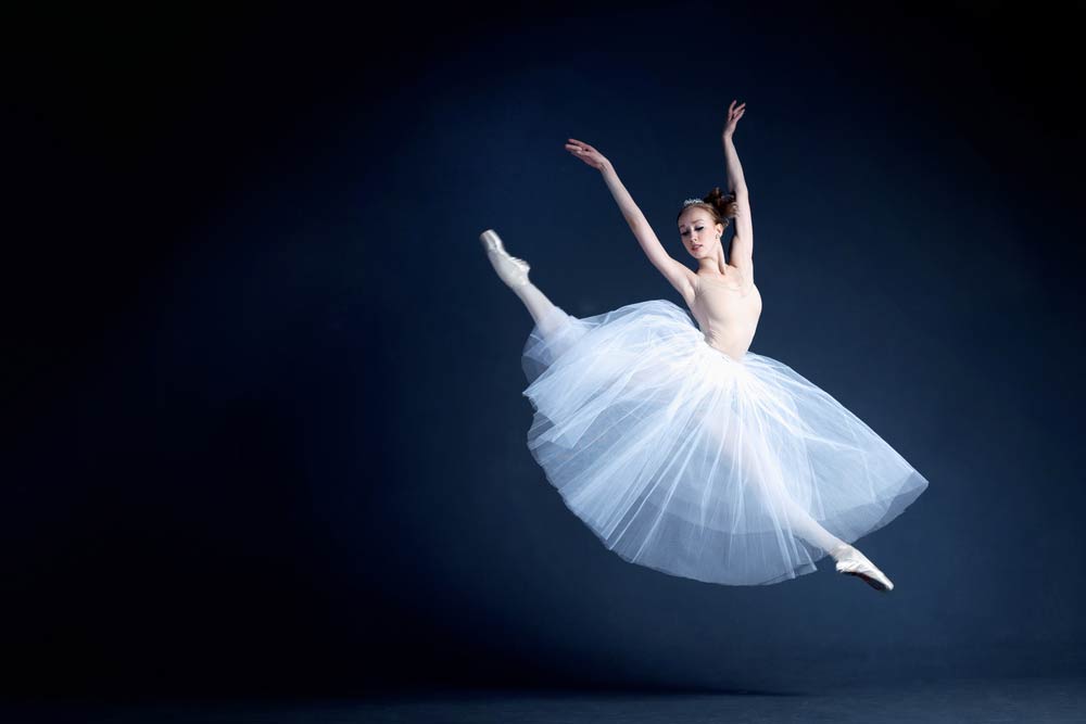 Be agile, ballarina with dress jumps